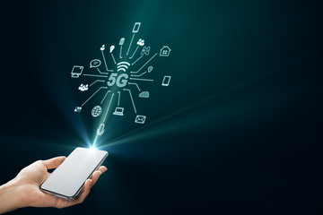 Hand with smartphone and 5G interface