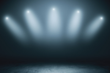 Abstract empty stage with grey smoky spotlights and concrete floor in dark room.