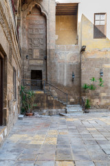 Courtyard of Prince Tax palace with staircase and entrance leading to the first floor