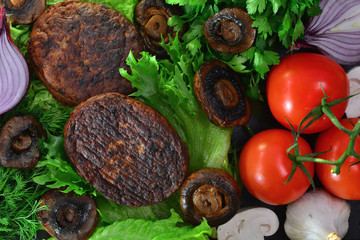 fried burger patties semi-finished with vegetables
