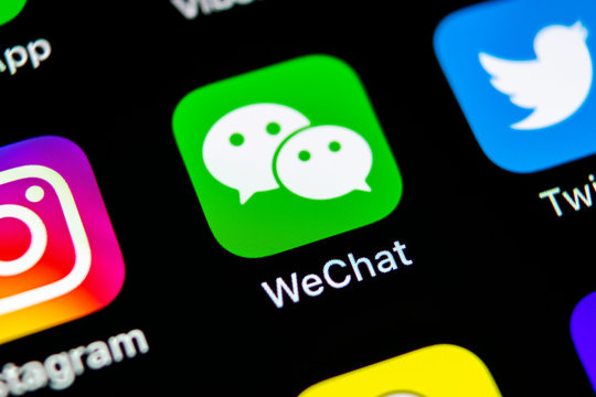 Sankt-Petersburg, Russia, May 10, 2018: Wechat messenger application icon on Apple iPhone X smartphone screen close-up. Wechat messenger app icon. Social media network.
