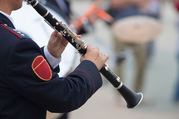 Fototapeta premium A wind instrument parade - a man playing clarinet
