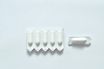 Fototapeta premium corticosteroid cream for hemorrhoid therapy used by insert in bottom hole packing on white background