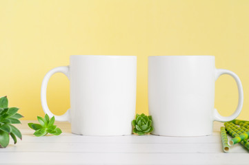 white mug mockup on a yellow background