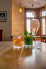 Enjoying delicious fresh cocktails with different ingredients in the bar