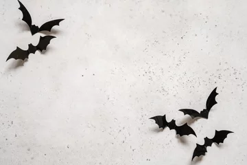 Gordijnen halloween decoration concept - black bats on white concrete background © azurita
