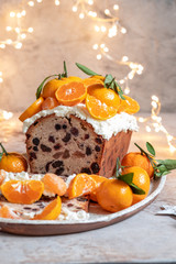 Christmas fruit cake decorated with a clementines