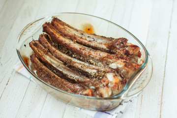 Fresh pork ribs marinated in spices. Delicious and hearty dinner.