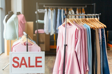 Discount sale sign in shopping mall clothing store