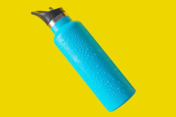 top view thermos water bottle. Blue water bottle wet isolated on yellow background - 283749821