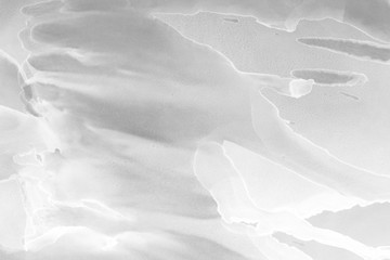 Hand painted white alcohol ink background. Abstract delicate gray texture. Contemporary wallpaper.