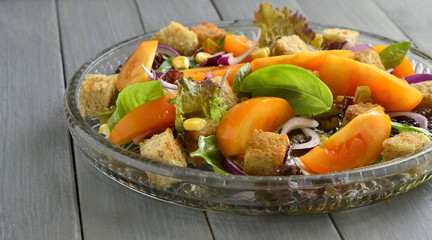 Salad with yellow tomatoes, sweet corn, basil and croutons, panzanella,  copy space