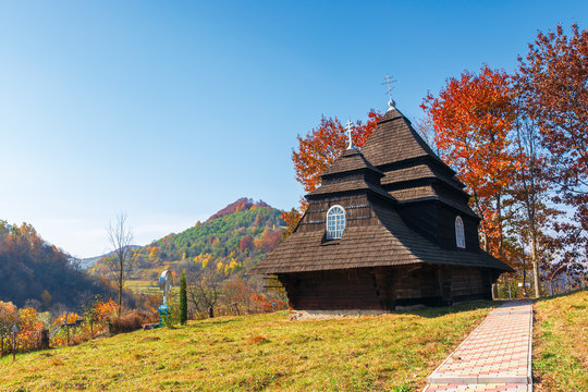 Church of the Archangel Michael - UNESCO World Heritage. old wooden building in mountains. wonderful sunny autumn weather. trees in fall foliage. cloudless sky