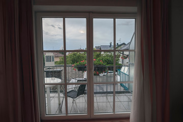 Looking through closed window in raindrops