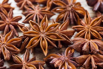 Badian Star anise on a wooden background. Selective focus.