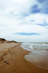 Fototapeta na wymiar Orange sand beach