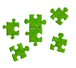 Fototapeta premium piece of jigsaw created wtih green moss texture on white background