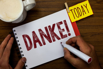 Writing note showing Danke. Business photo showcasing used as informal way of saying thank you in...