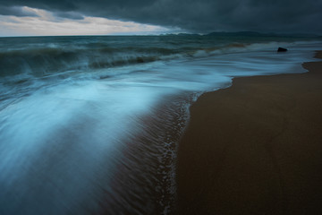 The chaos sea wave during storm forming on the beach of tropical ocean