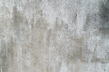 Closeup pale color and peeling of painted white cement wall texture background.