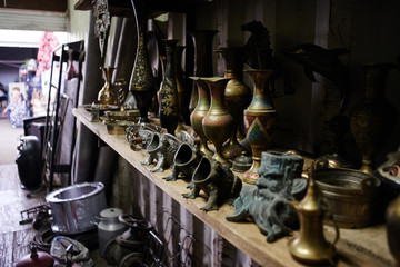 Old vintage rare vases, figurines and art objects are sold at the flea market, swap meet