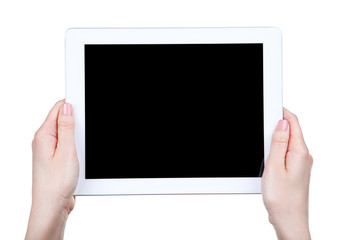 Tablet computer in female hands isolated on white background