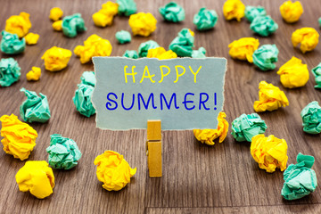 Fototapeta premium Text sign showing Happy Summer. Conceptual photo Beaches Sunshine Relaxation Warm Sunny Season Solstice Clothespin holding gray note paper crumpled papers several tries mistakes