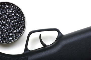 Black air rifle gun on a white