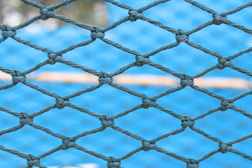 Naklejka premium Nylon rope that weave into the net with blurred background.
