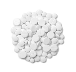 Heap of pills on white