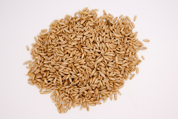 Fresh oats over white full as background