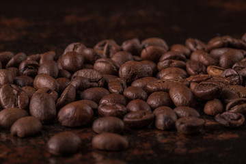 Coffee beans  on stone background. Top view with copy space for your text. Roasted coffee beans background. Beans texture, macro