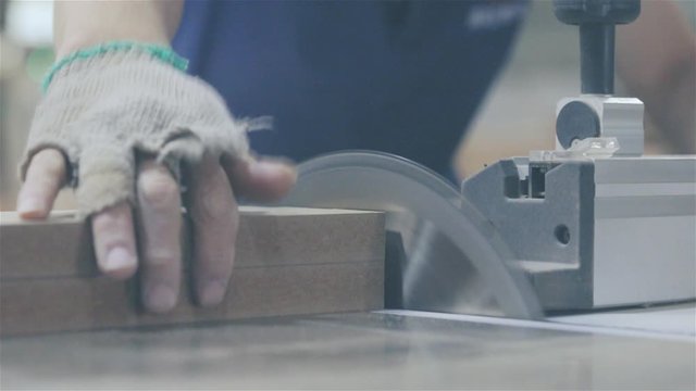 Furniture factory. Manufacture of furniture, facades of MDF and wood. Special machine cuts facades from MDF board. mdf details. furniture factory. Milling and sawing machine for processing wood.