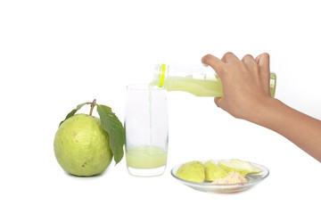 hand pour guava Juice in glass , healthy and diet concept