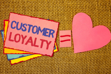 Writing note showing Customer Loyalty. Business photo showcasing Client Satisfaction Long-Term relation Confidence Pink yellow blue notes black red letters ideas equal sign heart wicker