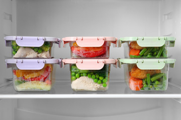 Boxes with prepared meals inside of refrigerator