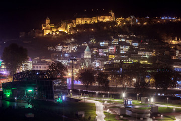 Fototapeta na wymiar Night view of old Tbilisi. Narikala Fortress and other landmarks of the city.