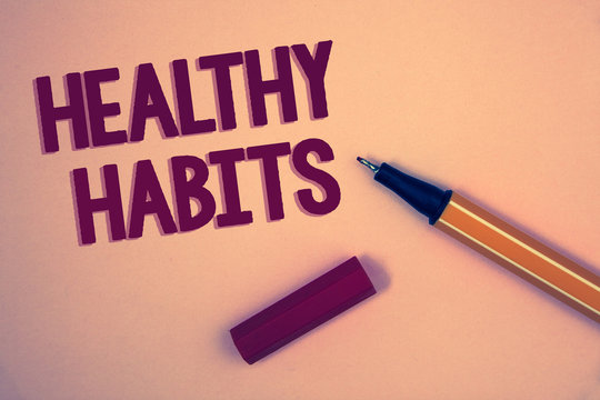 Conceptual hand writing showing Healthy Habits. Business photo showcasing Good nutrition diet take care of oneself Weight Control Words yellow background open blue yellow pen message letter
