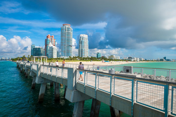 Bright scenic view of the skyline with a pier in the foreground at South Beach, Miami, Florida, USA