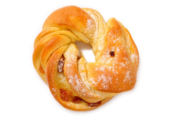 bake ring cake with icing sugar sliced and raisins. isolated on white background