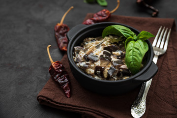 Eggplant curry on dark wooden background. Healthy food concept