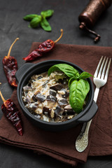 Eggplant curry on dark wooden background. Healthy food concept