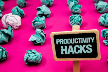 Text sign showing Productivity Hacks. Conceptual photo Hacking Solution Method Tips Efficiency Productivity Blackboard with white letter pink base much green paper lobs big white lob © Zofia