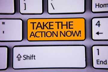 Handwriting text writing Take The Action Now Motivational Call. Concept meaning Act Start Promptly Immediate Instantly Silver color polished modern computer keyboard with yellow arrow button