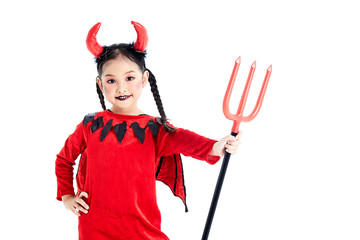 girl in a halloween fancy dress devil