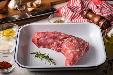 rubbing santa maria style sauce on tri-tip steak