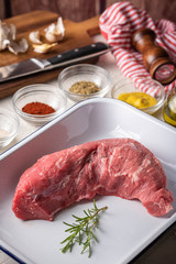 rubbing santa maria style sauce on tri-tip steak