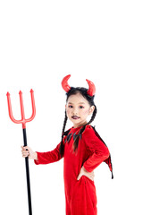 girl in a halloween fancy dress devil