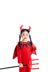 girl in a halloween fancy dress devil