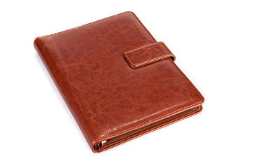Brown leather notebook on a white background